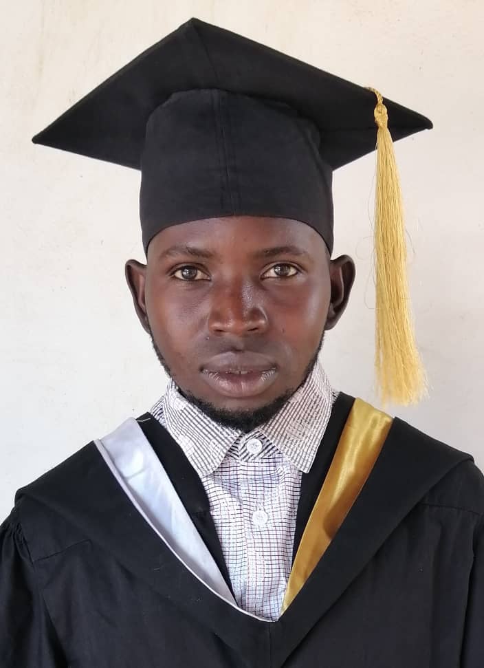 A student smiling after graduating from ECU